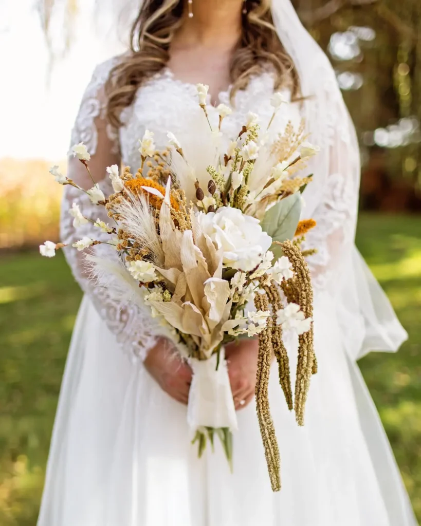 A bride holders her flowers at Old Coon Creek Wedding Venue in Beloit, Wisconsin