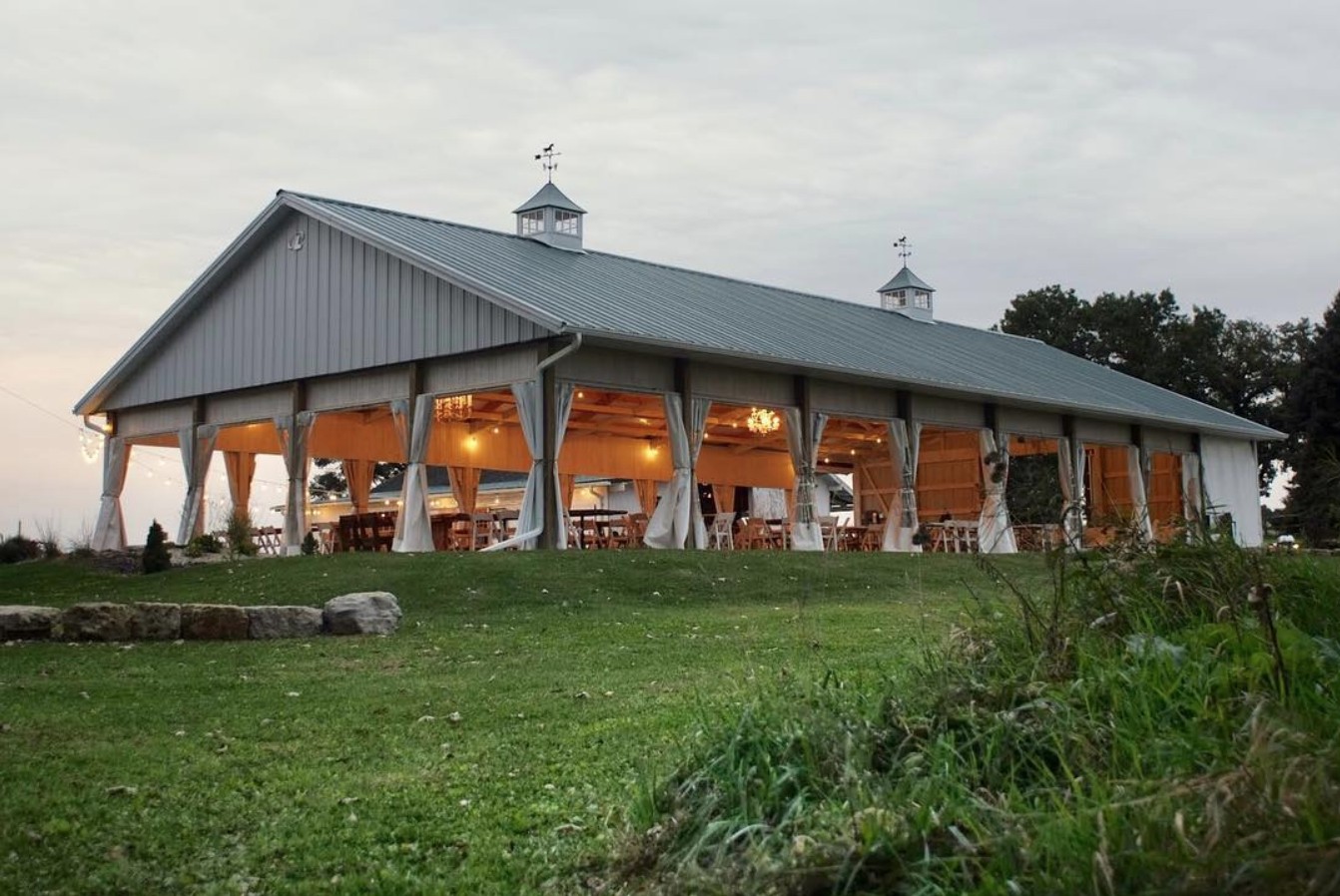 The reception pavilion is lit in preparation of a wedding at Old Coon Creek Wedding Venue in Beloit, Wisconsin