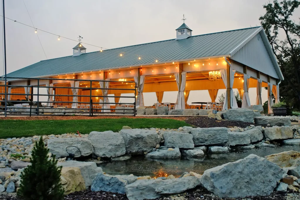The reception pavilion is lit in preparation of a wedding at Old Coon Creek Wedding Venue in Beloit, Wisconsin