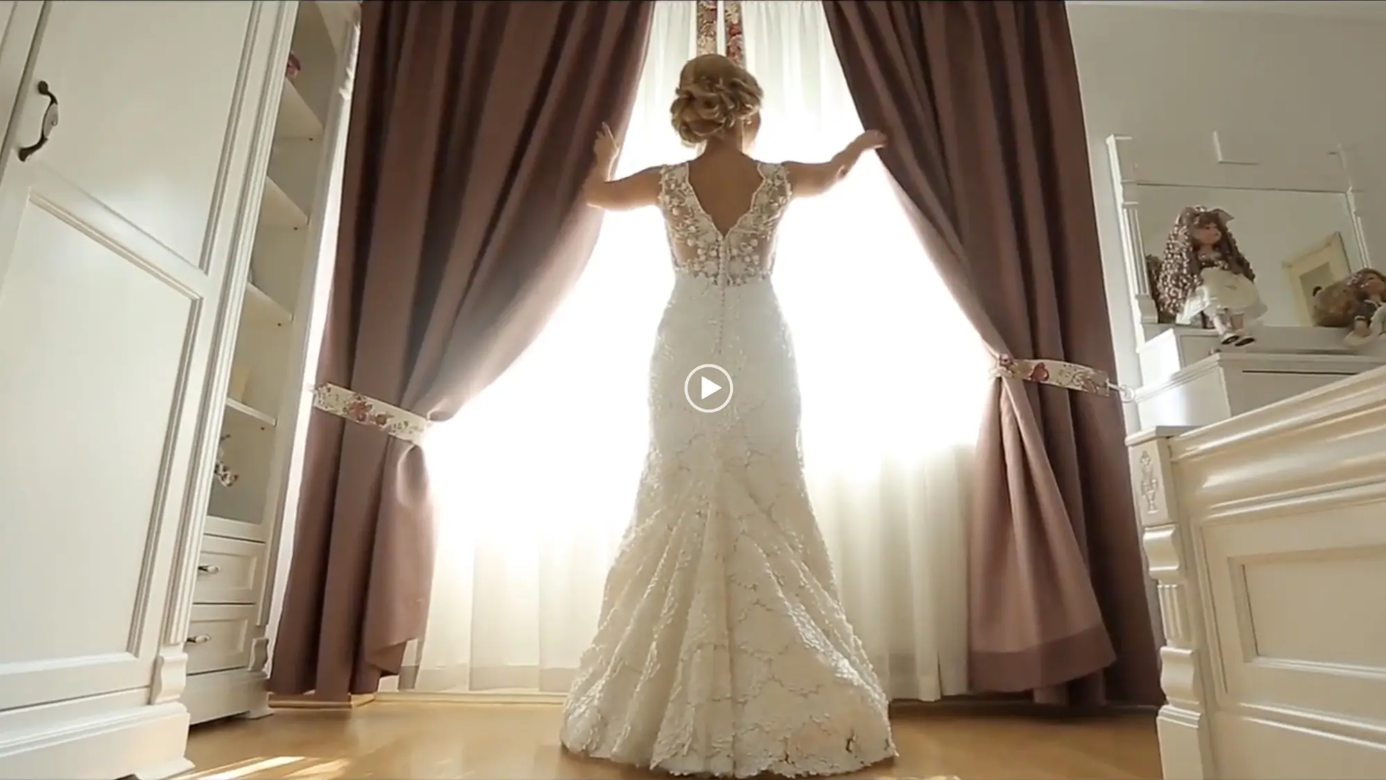 Video preview showing a bride opening up the curtains of a window in the bridal suite at Old Coon Creek Wedding Venue in Beloit, Wisconsin.